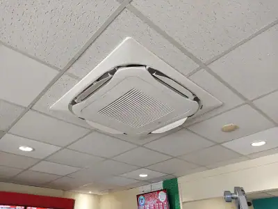 Ceiling mounted HVAC cassette for efficient heating and cooling solutions in commercial spaces.
